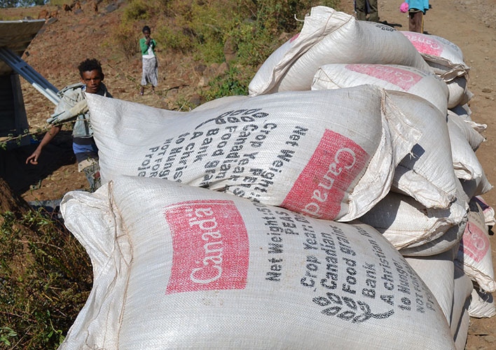 Bags of emergency grain await distribution by the side of the road in rural Ethiopia.