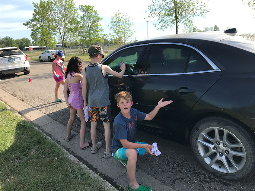 kids and a car
