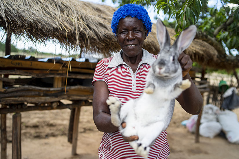 Eveline Masihoro of Mawere village shows off one of her rabbits