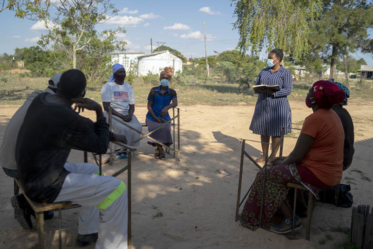 PAOZ gender officer Faith Gwitirwa meets with Mawere village's Gender Committee, which is helping women, men and children address gender-based violence.