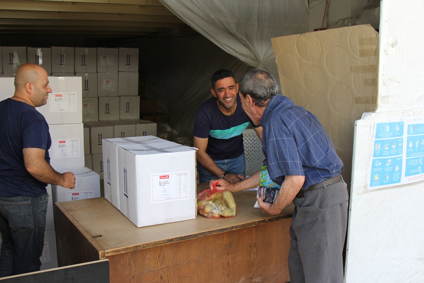 Man working at the food distribution center in the Beqaa Valley