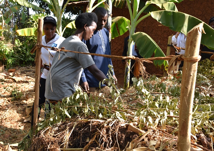 Two farmers showing their garden