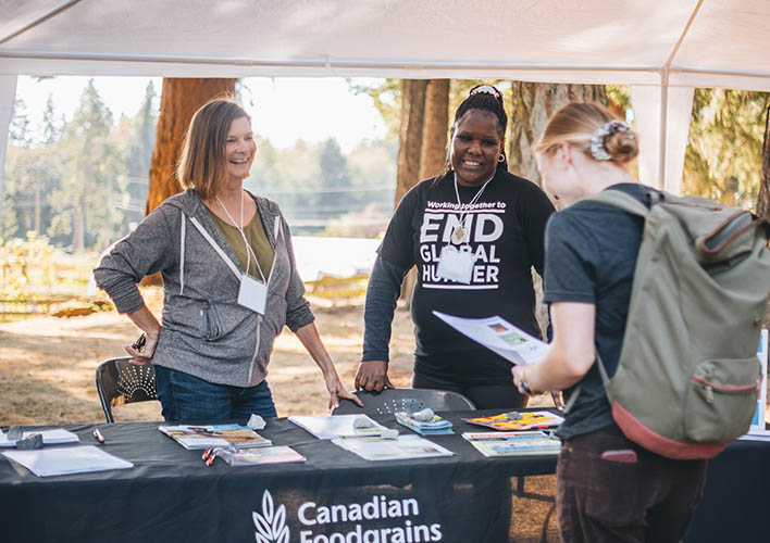 Foodgrains Bank staff Carol Thiessen and Florence Nduku speak with supporters on the importance of advocacy, at a collaborative event with A Rocha Canada. (Photo: Hannah Mae Henry, A Rocha Canada)