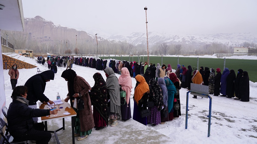 People in Afghanistan standing in line for food assistance.