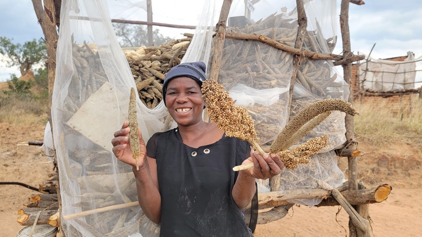 A woman holding up her harvest