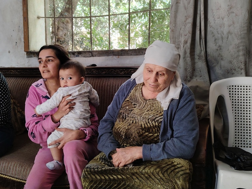 A family sitting in their home. 